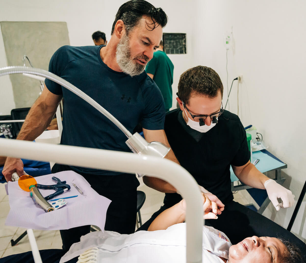 A dentist works with his mentor while on a humanitarian trip in Mexico.