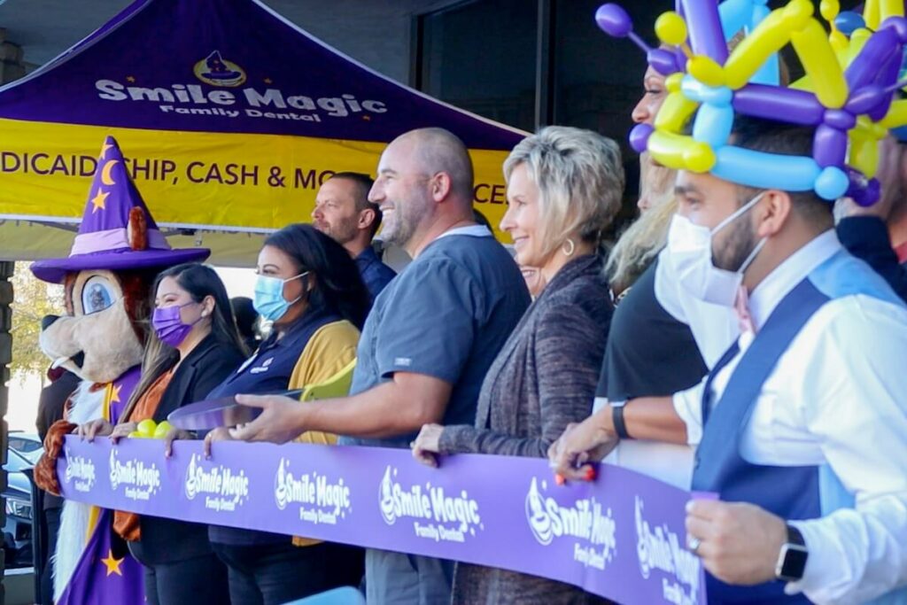 CDP employees at a ribbon cutting ceremony for a new Smile Magic dream job practice opening. 