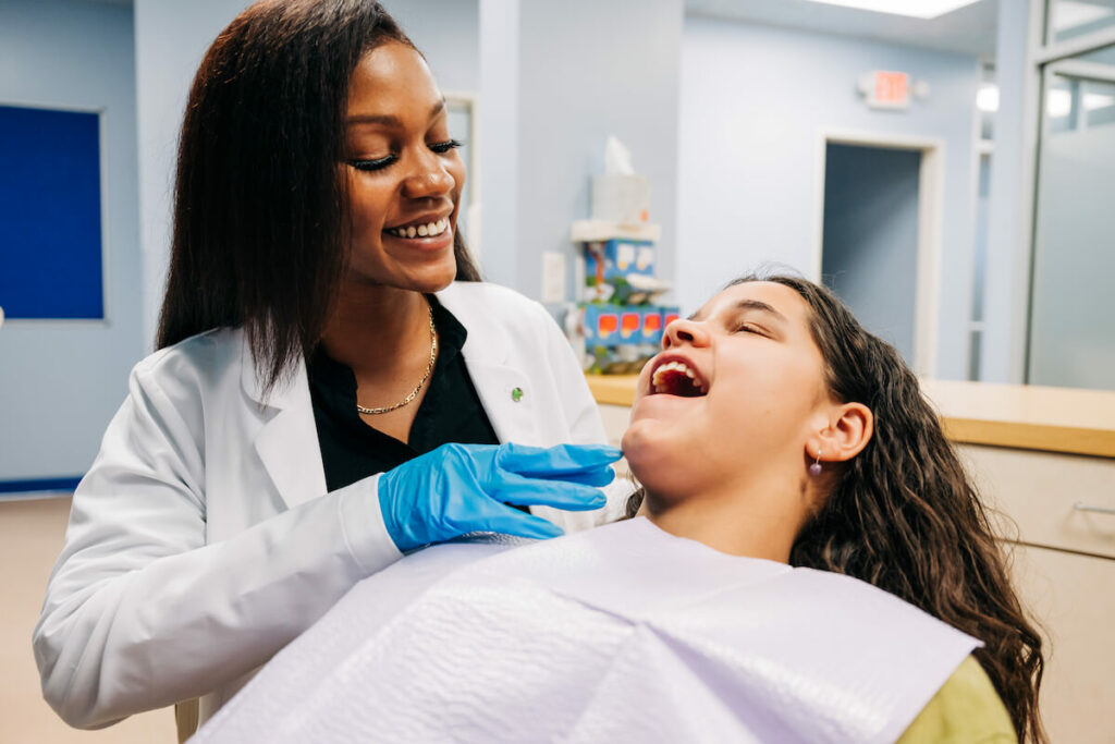 Female dentist with patient.